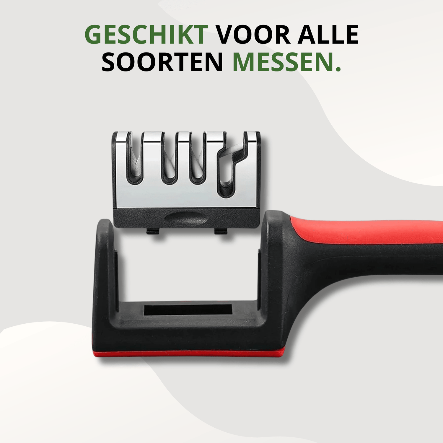 Knivix 4-in-1 messenslijper met afneembare slijpunit en zichtbaar handvat in zwart-rode uitvoering, gefotografeerd van bovenaf.