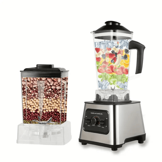 RVS PowerMix Pro blender met zwarte knop, gevuld met fruit en ijs, naast extra beker met peulvruchten.